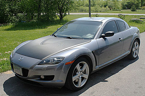 Mazda RX8 with carbon fibre finished hood and mirrors, window tinting, high gloss coating.